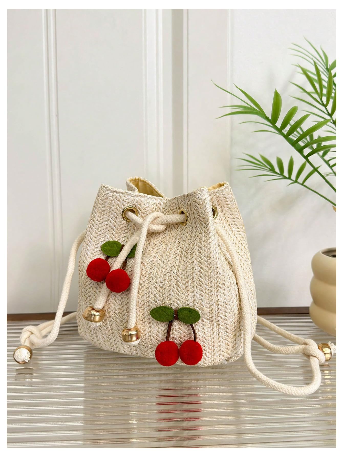 Beige woven drawstring cherry pom-pom bucket bag - Image 2