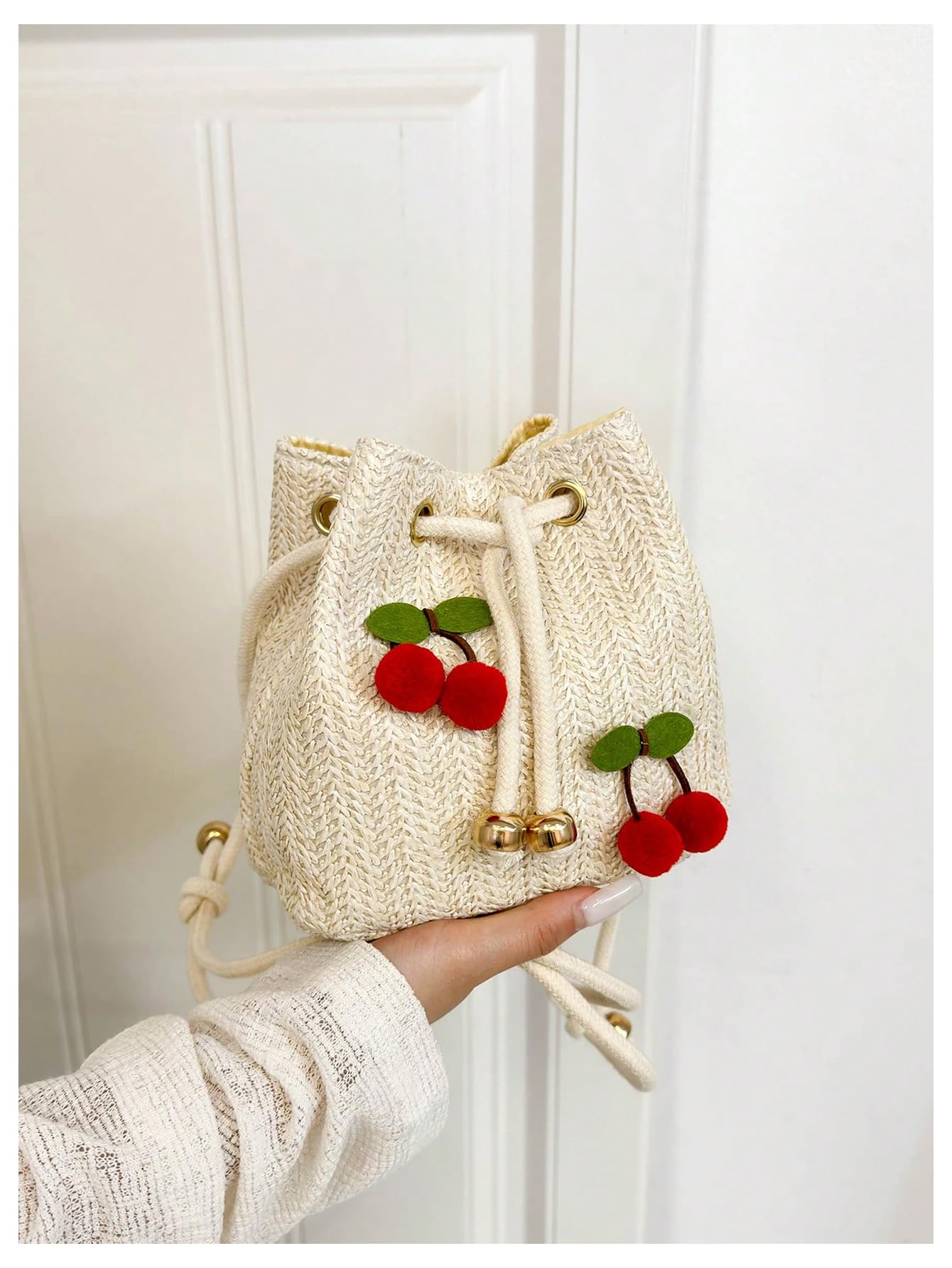 Beige woven drawstring cherry pom-pom bucket bag - Image 4